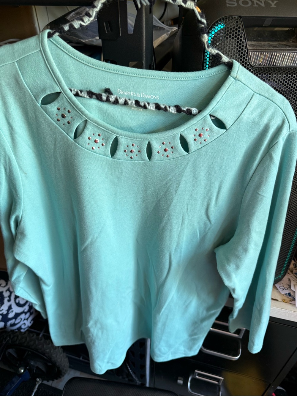 Drapers & Damons light green long-sleeve top featuring a cut-out neckline.